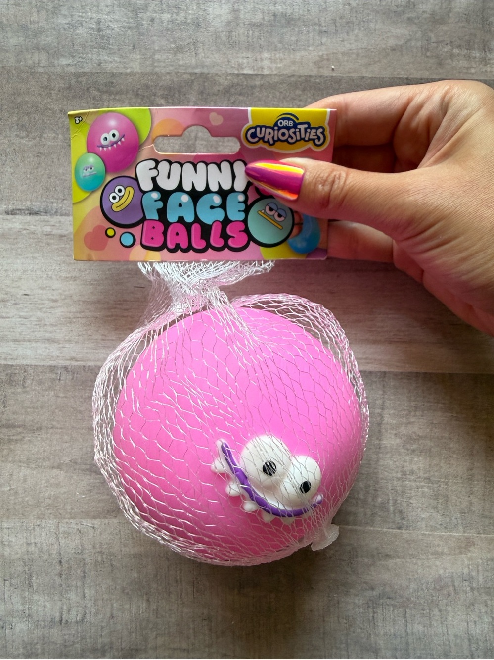 Orb Curiosities Funny Faces Squishy in Pink - Viral Fidget Toy